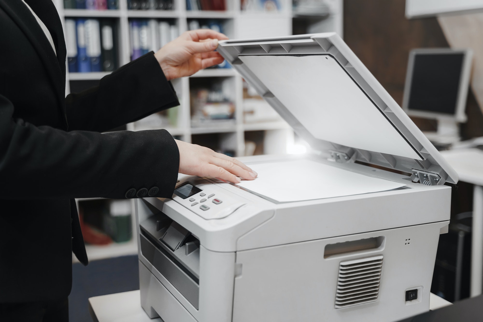 Woman's hand with working copier scanner printer